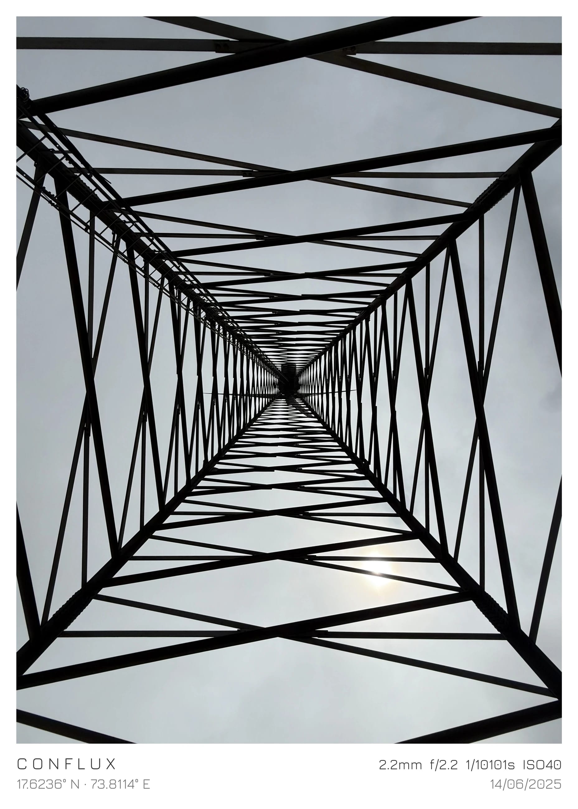 A steel lattice seen from below, converging toward the sky