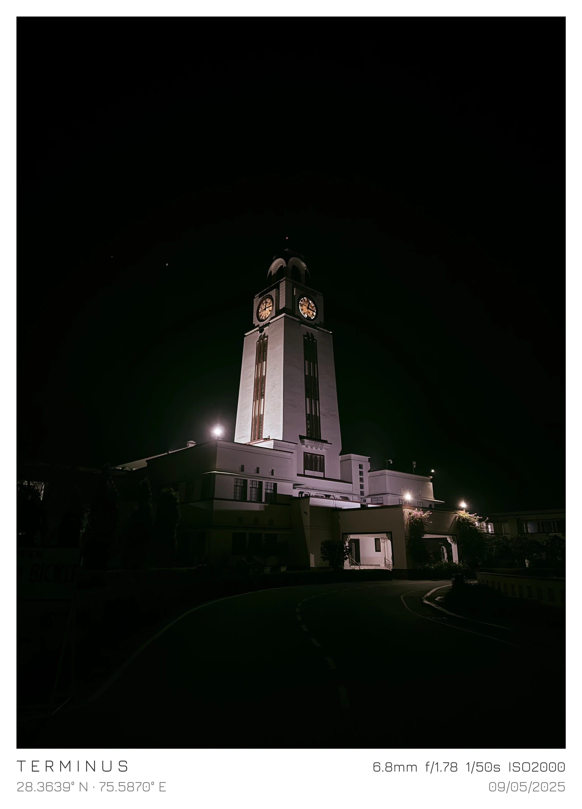 A clock tower illuminated against the night